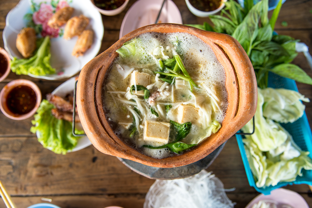 clay pot.Thai traditional spicy shabu shabu, dipping meat in boiled spicy soup.