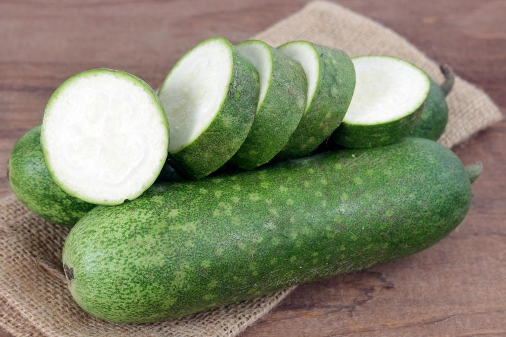 Asian wax squash gourd on the rustic table